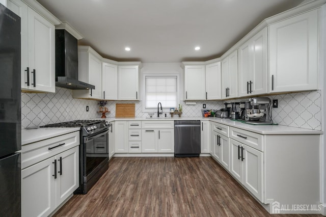 18 Chipper Dr, South Brunswick, NJ 08824 - kitchen featuring black appliances, wall chimney range hood, white cabinets, decorative backsplash, and recessed lighting