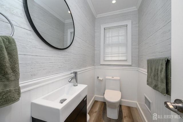 18 Chipper Dr, South Brunswick, NJ 08824 - bathroom featuring wood finished floors, crown molding, vanity, and a wainscoted wall