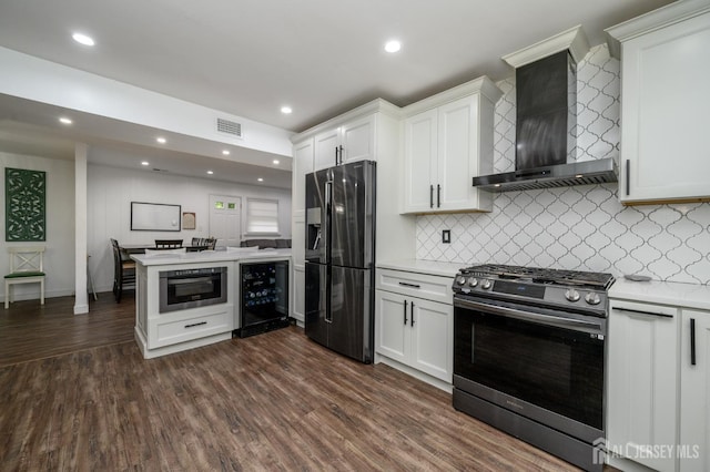 18 Chipper Dr, South Brunswick, NJ 08824 - kitchen with stainless steel appliances, wall chimney exhaust hood, beverage cooler, light countertops, and dark wood-type flooring