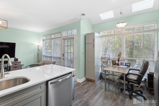 54 Magellan Way, Franklin Twsp, NJ 08823 - kitchen with stainless steel dishwasher, a skylight, a sink, dark wood-style flooring, and hanging light fixtures