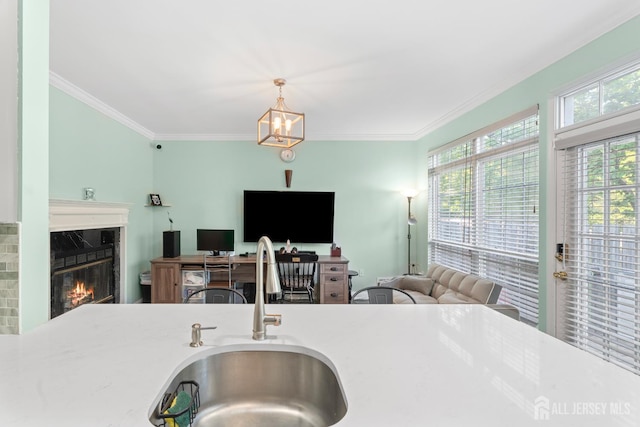 54 Magellan Way, Franklin Twsp, NJ 08823 - kitchen with a sink, ornamental molding, a fireplace, pendant lighting, and open floor plan