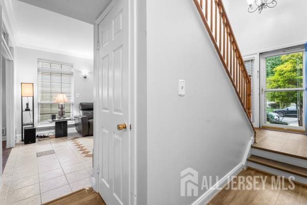 54 Magellan Way, Franklin Twsp, NJ 08823 - stairway featuring tile patterned floors and a chandelier