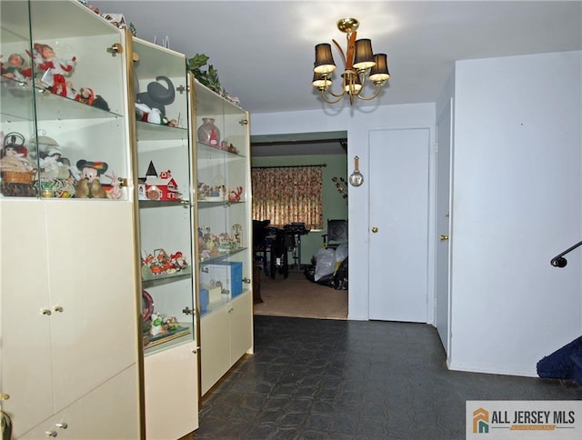 14 Albert Dr, Old Bridge, NJ 08857 - hall featuring a chandelier and dark flooring