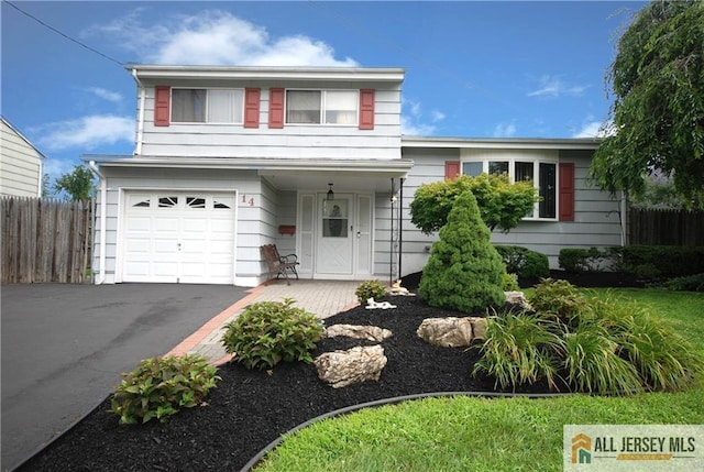 14 Albert Dr, Old Bridge, NJ 08857 - view of front facade featuring a garage and asphalt driveway