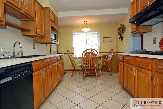 14 Albert Dr, Old Bridge, NJ 08857 - kitchen with dishwasher, extractor fan, light countertops, and brown cabinets