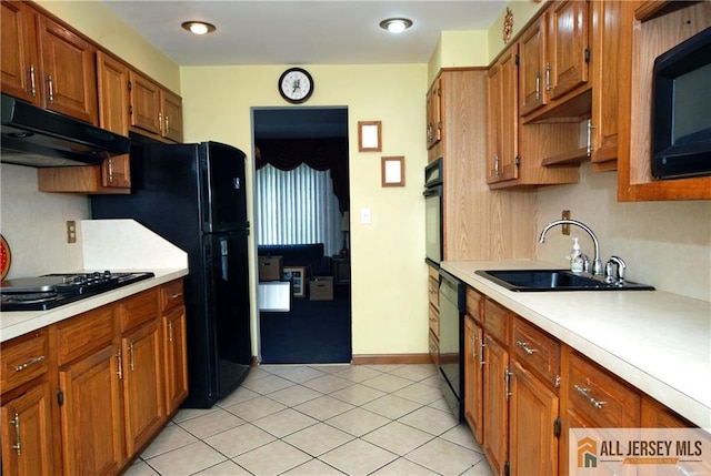 14 Albert Dr, Old Bridge, NJ 08857 - kitchen with light countertops, exhaust hood, brown cabinetry, and black appliances