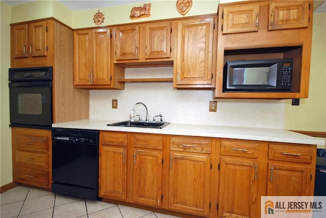 14 Albert Dr, Old Bridge, NJ 08857 - kitchen featuring black appliances, light countertops, light tile patterned flooring, and brown cabinets