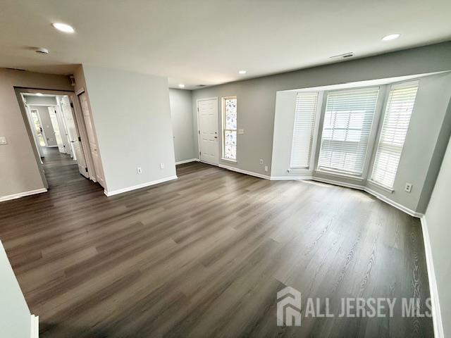3605 Riddle Ct, Bridgewater, NJ 08807 - unfurnished living room featuring dark wood-style flooring and recessed lighting