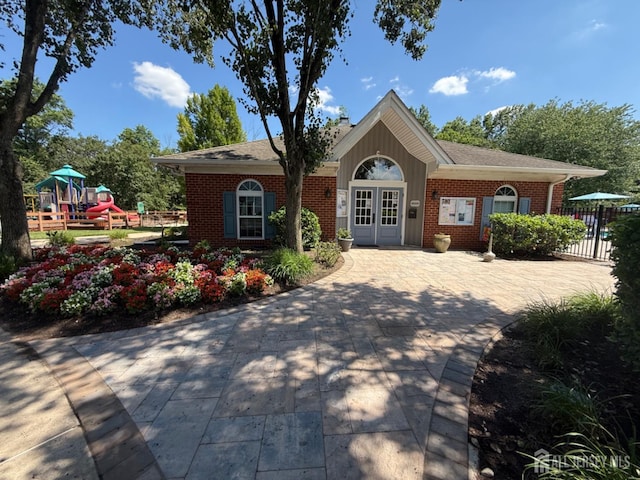 3605 Riddle Ct, Bridgewater, NJ 08807 - ranch-style house featuring brick siding, a playground, french doors, and a chimney