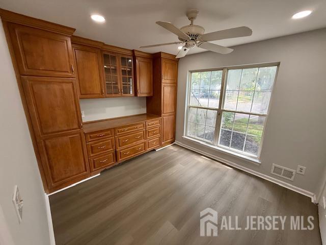 3605 Riddle Ct, Bridgewater, NJ 08807 - kitchen with brown cabinets, a ceiling fan, glass insert cabinets, dark wood-style floors, and recessed lighting