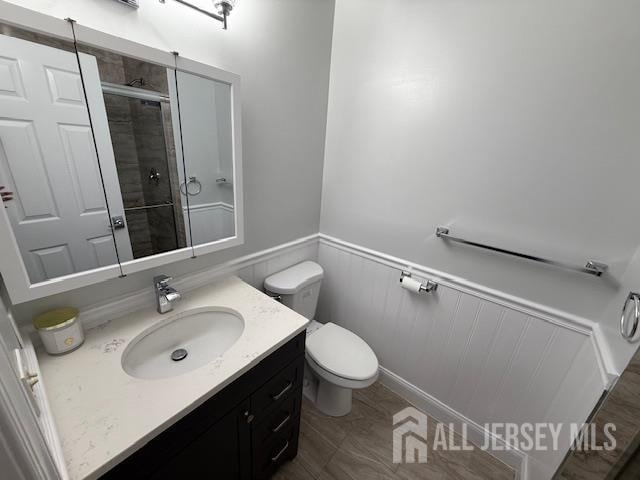 3605 Riddle Ct, Bridgewater, NJ 08807 - bathroom with a stall shower, vanity, and a wainscoted wall