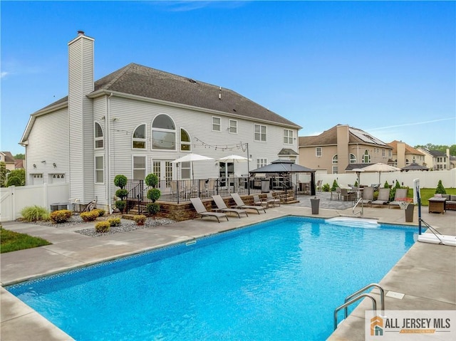 8 Adam Ct, Monroe, NJ 08831 - view of pool with a gazebo, a patio, a residential view, and cooling unit
