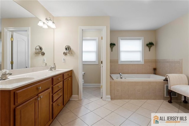 8 Adam Ct, Monroe, NJ 08831 - full bathroom featuring tile patterned floors, a bath, toilet, and double vanity