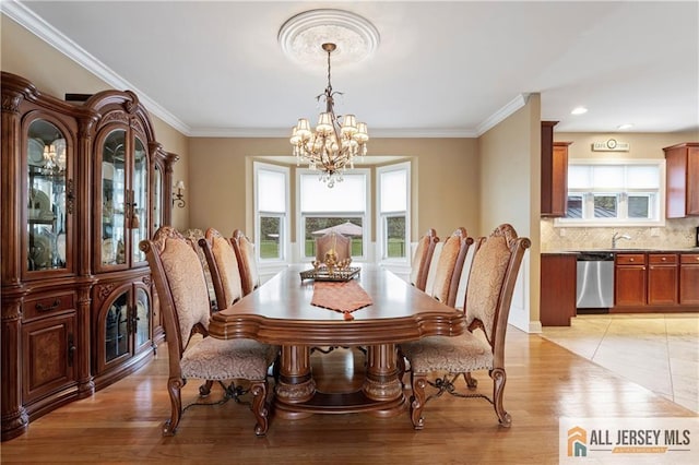 8 Adam Ct, Monroe, NJ 08831 - dining room with a chandelier, healthy amount of natural light, light wood-type flooring, ornamental molding, and baseboards