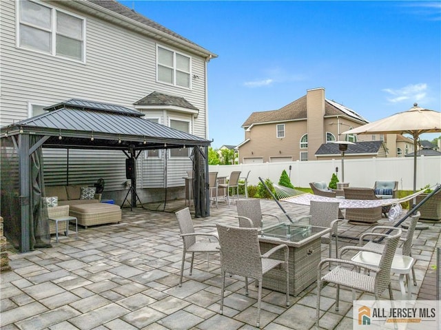 8 Adam Ct, Monroe, NJ 08831 - fenced backyard featuring an outdoor living space with a fire pit, a gazebo, and a patio area