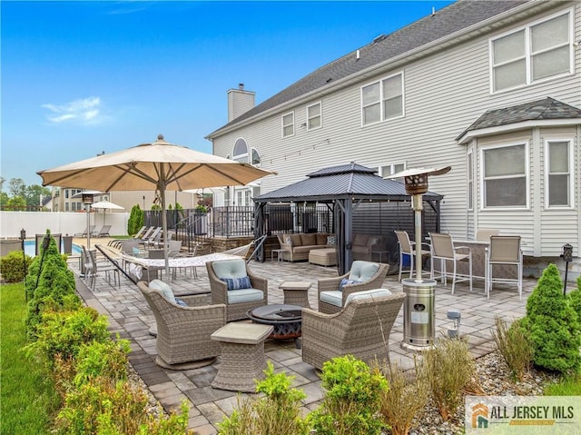 8 Adam Ct, Monroe, NJ 08831 - view of patio with an outdoor living space with a fire pit and a gazebo