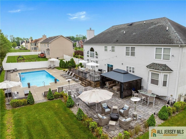8 Adam Ct, Monroe, NJ 08831 - rear view of property with a gazebo, outdoor dining area, a patio, an outdoor hangout area, and a shingled roof