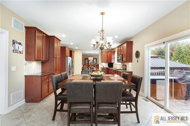 8 Adam Ct, Monroe, NJ 08831 - dining area with a chandelier, light tile patterned flooring, recessed lighting, and baseboards