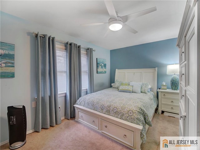 bedroom with baseboards, light colored carpet, and ceiling fan