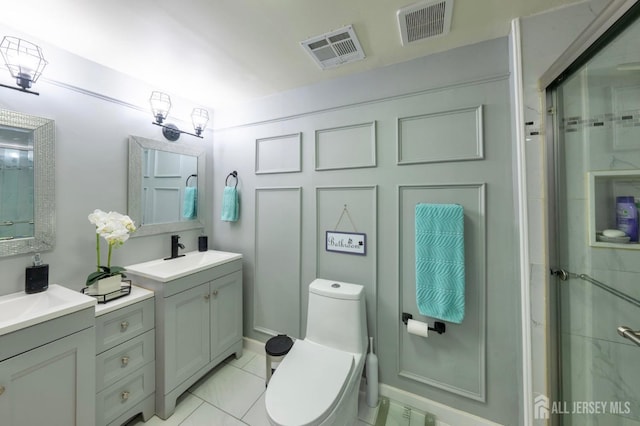 11 Mary Ave, Fords, NJ 08863 - bathroom featuring toilet, a shower stall, two vanities, and tile patterned flooring