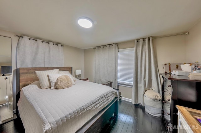 bedroom featuring dark wood-style flooring