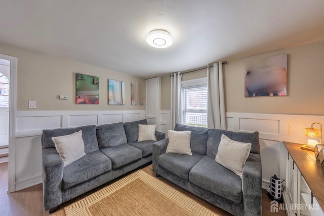 11 Mary Ave, Fords, NJ 08863 - living room with wood finished floors, a wainscoted wall, and a decorative wall