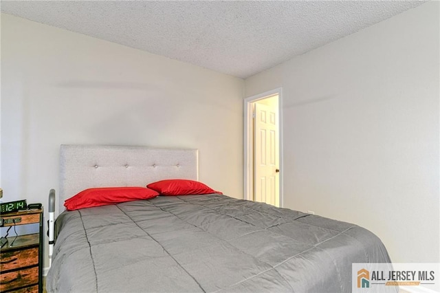 bedroom featuring a textured ceiling