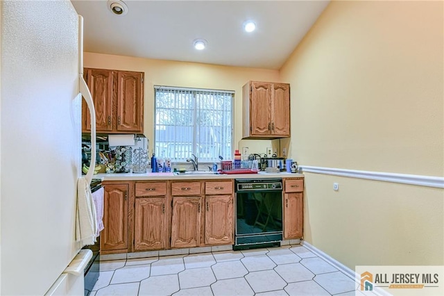 kitchen featuring tasteful backsplash, dishwasher, sink, and white refrigerator