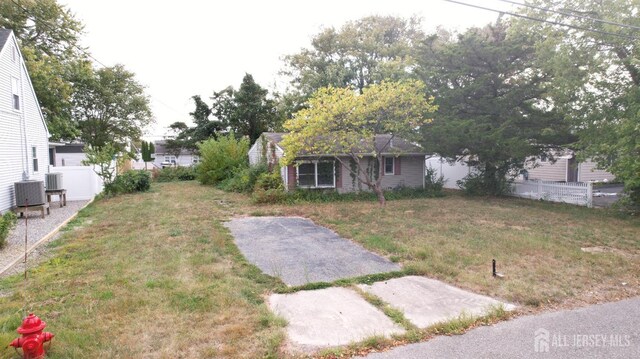 view of yard with central air condition unit