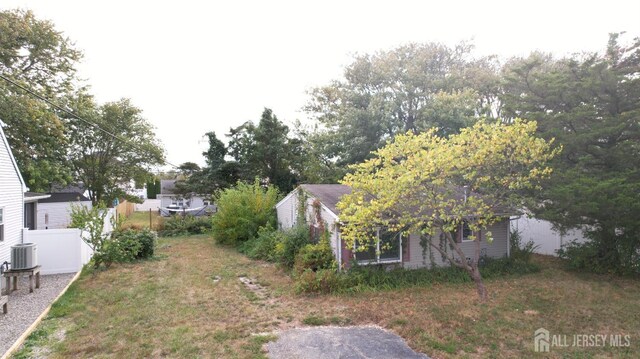 view of yard featuring central AC