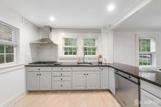 328 John St, Bound Brook, NJ 08805 - kitchen with appliances with stainless steel finishes, wall chimney exhaust hood, tasteful backsplash, dark stone countertops, and recessed lighting