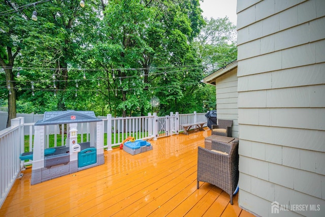 328 John St, Bound Brook, NJ 08805 - wooden deck featuring a fenced backyard and view of scattered trees
