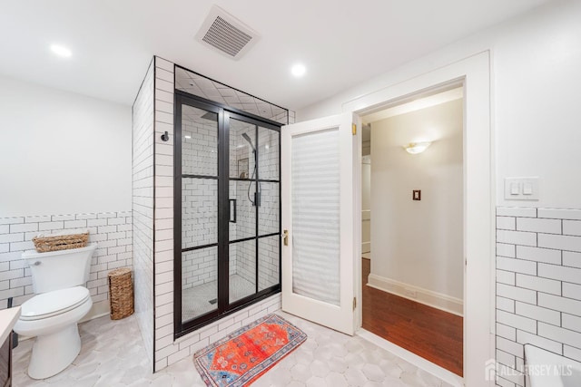 328 John St, Bound Brook, NJ 08805 - bathroom featuring a stall shower, tile walls, recessed lighting, and wainscoting