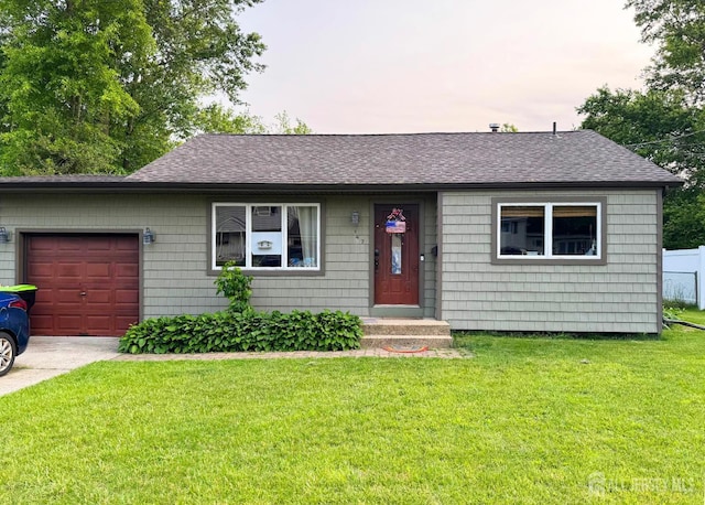 147 Cindy St, Old Bridge, NJ 08857 - ranch-style home featuring an attached garage, roof with shingles, a front lawn, and driveway