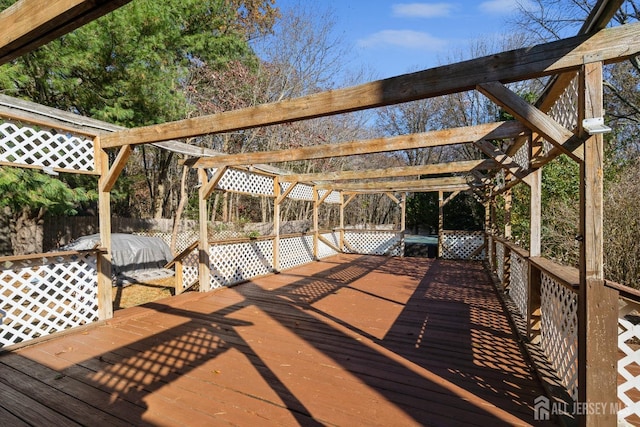 wooden deck featuring fence