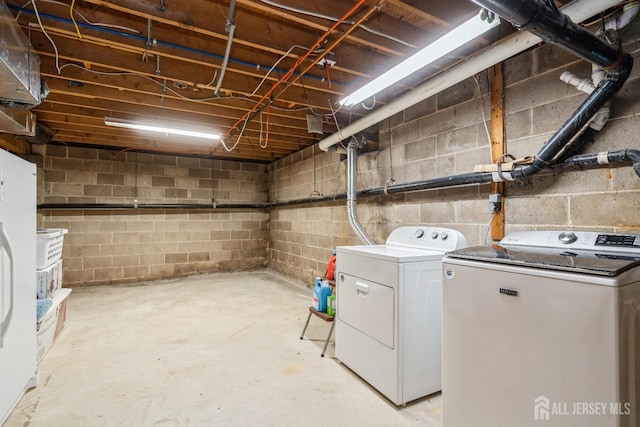 unfinished below grade area with washing machine and dryer