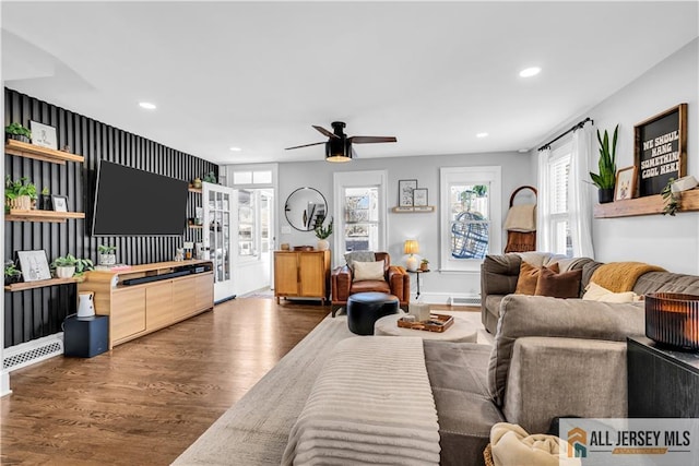 living room with baseboards, a ceiling fan, recessed lighting, and wood finished floors