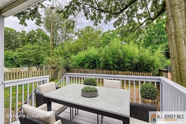 31 Lehigh Ave, Edison, NJ 08837 - wooden deck with outdoor dining space and a fenced backyard