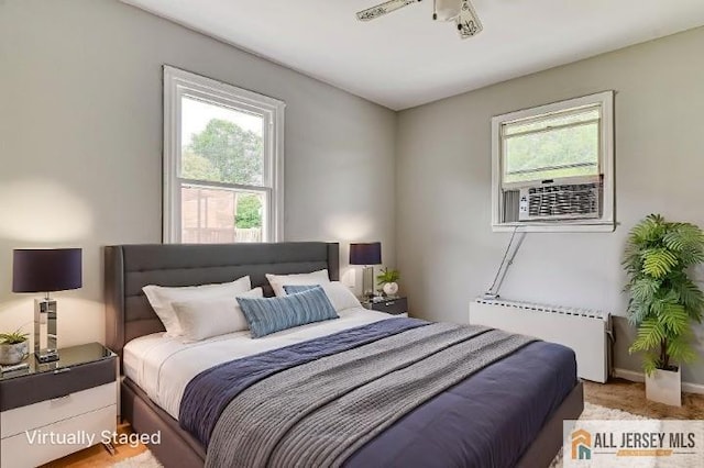 31 Lehigh Ave, Edison, NJ 08837 - bedroom featuring radiator heating unit and multiple windows