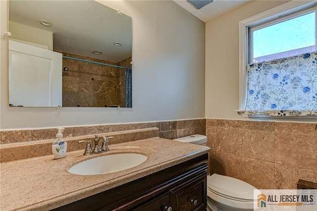 31 Lehigh Ave, Edison, NJ 08837 - bathroom featuring tile walls, vanity, a shower with shower curtain, and wainscoting