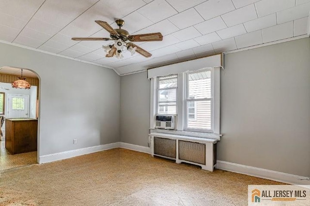 31 Lehigh Ave, Edison, NJ 08837 - spare room featuring healthy amount of natural light, a ceiling fan, arched walkways, radiator, and ornamental molding