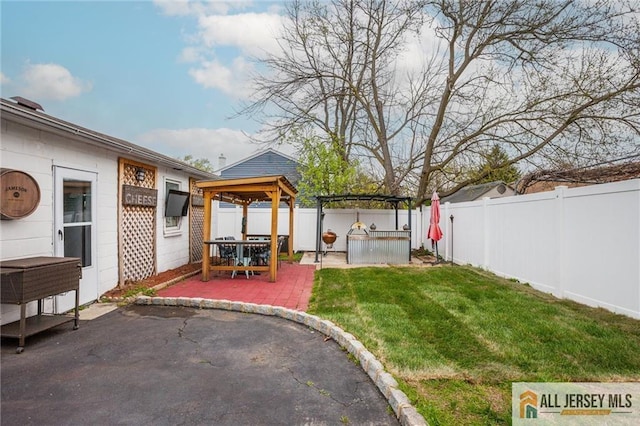 view of yard with a gazebo and a patio