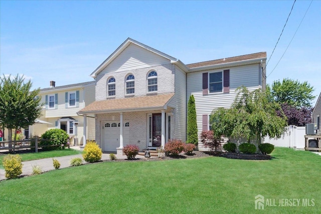 view of front facade featuring a garage and a front yard