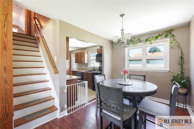 63 W Iselin Pkwy, Iselin, NJ 08830 - dining space with a chandelier, dark wood finished floors, and stairs