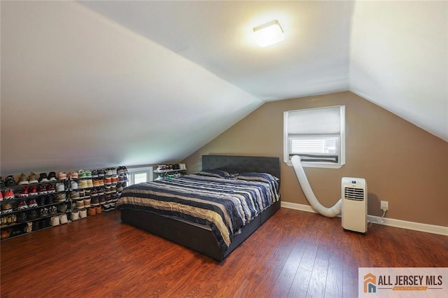 63 W Iselin Pkwy, Iselin, NJ 08830 - bedroom with multiple windows, wood finished floors, and lofted ceiling