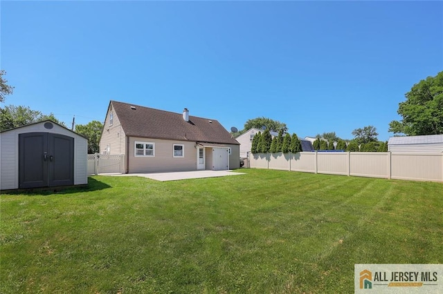 63 W Iselin Pkwy, Iselin, NJ 08830 - rear view of property featuring a patio area, a storage unit, and a fenced backyard