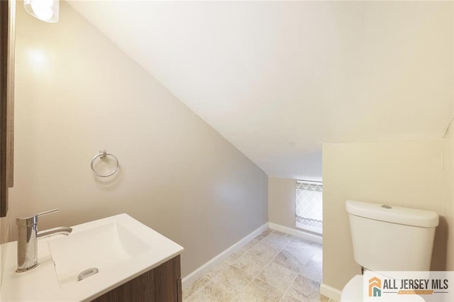 63 W Iselin Pkwy, Iselin, NJ 08830 - bathroom with lofted ceiling and vanity