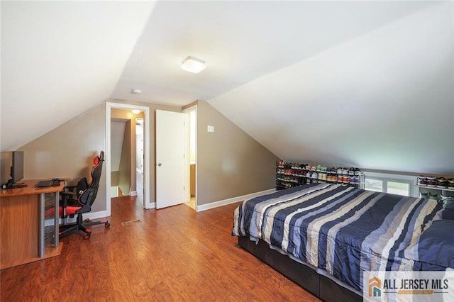 63 W Iselin Pkwy, Iselin, NJ 08830 - bedroom with wood finished floors, an office area, and vaulted ceiling
