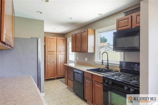 63 W Iselin Pkwy, Iselin, NJ 08830 - kitchen featuring black appliances, light countertops, recessed lighting, light tile patterned floors, and brown cabinetry