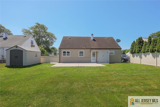 63 W Iselin Pkwy, Iselin, NJ 08830 - back of property featuring a patio area, a shed, and a fenced backyard